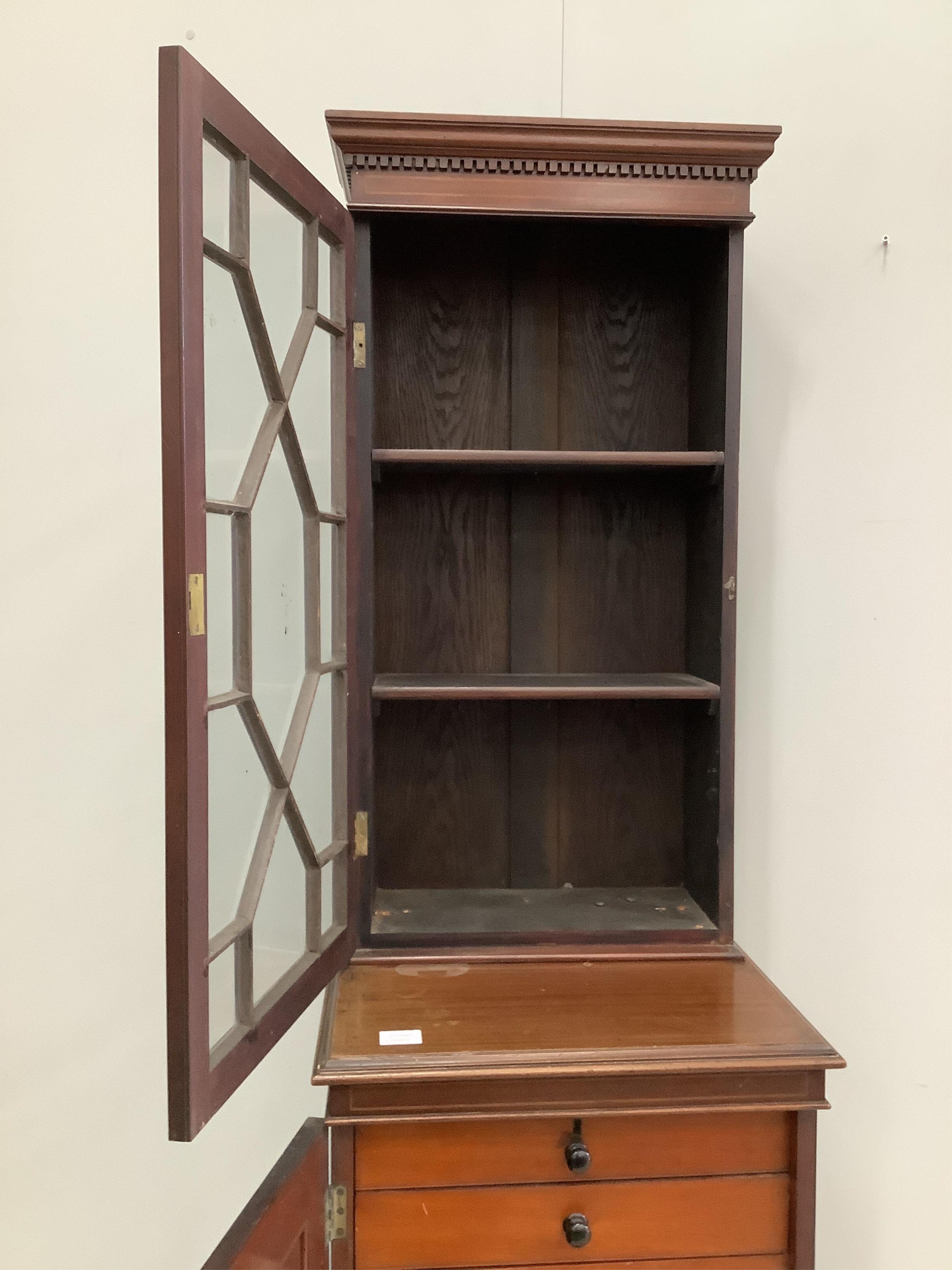 An Edwardian inlaid mahogany bookcase / collector's cabinet of narrow proportions, width 51cm, depth 46cm, height 187cm